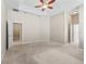 Large main bedroom featuring neutral paint and carpet, with attached bathroom and walk-in closet at 10927 Se 168Th Loop, Summerfield, FL 34491