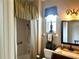Bathroom featuring a shower with curtain, and vanity with granite counter at 12183 Se 178Th St, Summerfield, FL 34491