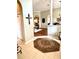 Welcoming foyer with tiled floor, arched doorways, and views into the living spaces at 12183 Se 178Th St, Summerfield, FL 34491