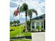 This house features a lush lawn and mature landscaping with beautiful curb appeal at 12183 Se 178Th St, Summerfield, FL 34491