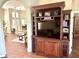 Open-concept living space with a large entertainment center and views into other rooms at 12183 Se 178Th St, Summerfield, FL 34491