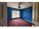 Bedroom with a large window, plush carpet, ceiling fan, and closet at 12512 Draw Dr Dr, Grand Island, FL 32735
