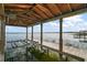 Picturesque boat lift on the water offers convenience and scenic lake views, ideal for boating enthusiasts at 13033 Se 158Th Ln, Weirsdale, FL 32195