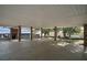Spacious carport featuring brick columns and ample room for parking and outdoor activities with lush landscaping at 13033 Se 158Th Ln, Weirsdale, FL 32195
