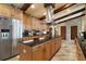 Spacious kitchen with stainless steel appliances, a large island, and ample counter space at 13033 Se 158Th Ln, Weirsdale, FL 32195