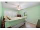 A carpet-free bedroom features two closets and a bright window view at 135 N James Pl, Groveland, FL 34736