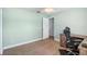 A carpet-free bedroom includes a ceiling fan and is freshly painted at 135 N James Pl, Groveland, FL 34736