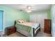 A bright bedroom with two closets features a comfortable bed with soft pillows at 135 N James Pl, Groveland, FL 34736