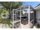 A relaxing hot tub enclosed in a screen offers privacy and protection from the elements at 135 N James Pl, Groveland, FL 34736
