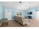 Inviting living room featuring a comfortable seating arrangement, ceiling fan and modern decor at 135 N James Pl, Groveland, FL 34736