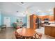 Open floor plan featuring kitchen, dining, and living spaces with ample natural light at 135 N James Pl, Groveland, FL 34736