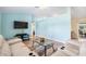 Inviting living room featuring a comfortable seating arrangement and modern decor at 135 N James Pl, Groveland, FL 34736