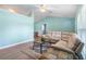 Open-concept living room showcasing a comfortable sectional sofa and seamless transition to dining area at 135 N James Pl, Groveland, FL 34736