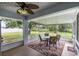 Relax on the screened lanai with outdoor seating and views of the backyard at 135 N James Pl, Groveland, FL 34736
