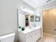 Well-maintained bathroom features a white vanity and ample countertop space at 13700 Se 90Th Ct, Summerfield, FL 34491