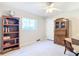 Neutral bedroom with a ceiling fan and wood furniture at 13700 Se 90Th Ct, Summerfield, FL 34491