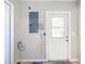Unfinished mud room with door to the exterior at 13700 Se 90Th Ct, Summerfield, FL 34491
