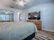 Bedroom with a large closet and a view into the bathroom, showing spacious layout at 1419 Arbor Trl, The Villages, FL 32162