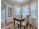 Charming dining area features a wooden table with upholstered chairs and natural light, ideal for Gathering meals at 1419 Arbor Trl, The Villages, FL 32162