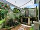 Tranquil garden area with lattice backdrop, perfect for relaxation and gardening at 1419 Arbor Trl, The Villages, FL 32162