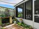 Charming garden area with potting bench and lush landscaping next to the home at 1419 Arbor Trl, The Villages, FL 32162