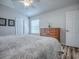 Cozy main bedroom boasts vinyl floors, natural lighting, and neutral tones, offering a peaceful and inviting space at 1419 Arbor Trl, The Villages, FL 32162