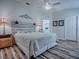 Serene main bedroom features a decorative headboard, coordinating nightstands, and stylish decor creating a relaxing retreat at 1419 Arbor Trl, The Villages, FL 32162