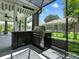 Outdoor kitchen with a grill and a view of the yard at 1419 Arbor Trl, The Villages, FL 32162