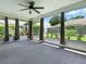 Spacious screened lanai with curtains and view of the lush, fenced backyard at 1419 Arbor Trl, The Villages, FL 32162