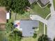 Aerial view of the property highlighting the layout, landscaping, long driveway, and outdoor features at 14708 Timucua Pl, Clermont, FL 34711