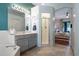Bathroom with walk in shower, tub and vanity at 14708 Timucua Pl, Clermont, FL 34711