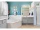 Bathroom featuring tub, vanity, and shower at 14708 Timucua Pl, Clermont, FL 34711