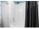 Clean white shower and tub combination with a white tile surround at 14708 Timucua Pl, Clermont, FL 34711