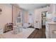Adorable ' bedroom featuring a canopy bed, play furniture, and natural lighting at 14708 Timucua Pl, Clermont, FL 34711