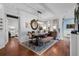 Inviting dining room featuring a wood table, stylish rug, and access to other rooms at 14708 Timucua Pl, Clermont, FL 34711