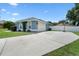 Spacious driveway leading to a two-car garage, plus a basketball hoop for outdoor fun at 14708 Timucua Pl, Clermont, FL 34711