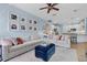 Spacious living room flowing into kitchen, with comfortable seating and natural light at 14708 Timucua Pl, Clermont, FL 34711