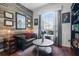 Cozy office with wood paneled wall, built in bookshelves, and window at 14708 Timucua Pl, Clermont, FL 34711