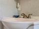 Close-up of a bathroom sink with a vintage-style faucet and small decorative bowl at 1537 Ne 22Nd St, Ocala, FL 34470