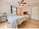 Bright bedroom features wood floors, ceiling fan, and neutral decor at 1537 Ne 22Nd St, Ocala, FL 34470