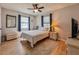 Bright bedroom features wood floors, ceiling fan, and neutral decor at 1537 Ne 22Nd St, Ocala, FL 34470