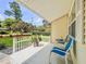Cozy front porch with seating and a view of the landscaped yard, perfect for relaxing and enjoying the outdoors at 1537 Ne 22Nd St, Ocala, FL 34470