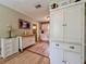 Charming kitchen featuring custom cabinetry and light wood flooring at 1537 Ne 22Nd St, Ocala, FL 34470
