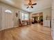 Bright and airy living room with hardwood floors, a charming front door and access to more living areas at 1537 Ne 22Nd St, Ocala, FL 34470