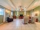 Open living room featuring tile flooring, comfortable seating and natural light at 1537 Ne 22Nd St, Ocala, FL 34470