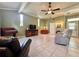 Spacious living room boasting tile flooring and comfortable seating with overhead lighting at 1537 Ne 22Nd St, Ocala, FL 34470