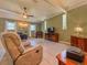 Expansive living room with comfortable seating and a ceiling fan at 1537 Ne 22Nd St, Ocala, FL 34470
