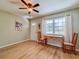 Bright living room featuring new laminate flooring, and a large window, creating a comfortable and inviting space at 1537 Ne 22Nd St, Ocala, FL 34470