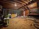 Shed interior featuring plywood floor, tools, a ladder, and storage containers at 1537 Ne 22Nd St, Ocala, FL 34470