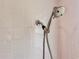 Modern shower head with multiple settings set against a tiled wall at 1537 Ne 22Nd St, Ocala, FL 34470